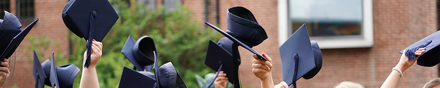 Graduate hats in air